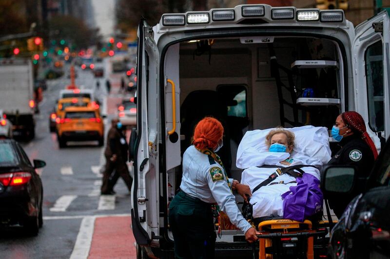 A patient is transported outside of Tisch Hospital in New York, US. AFP