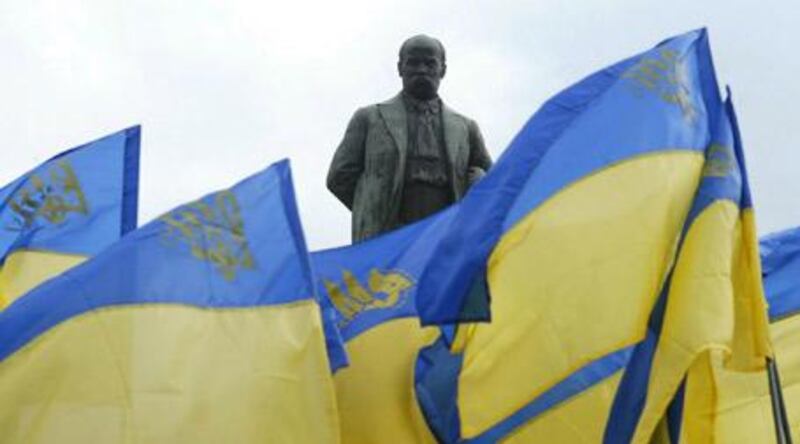 A statue of the poet Taras Shevchenko, considered the father of modern Ukranian literature, looms above Ukranian flags at a 2004 opposition rally in Kiev.