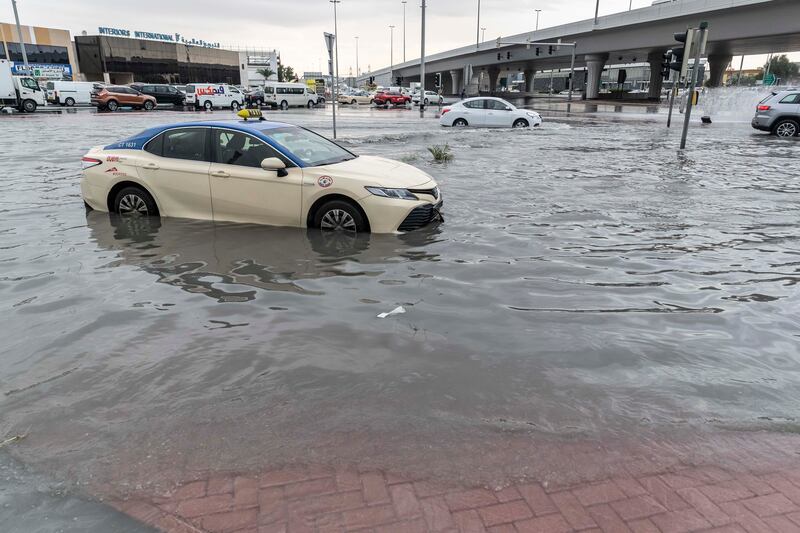 A taxi stalls in the water in Al Quoz. Antonie Robertson / The National


