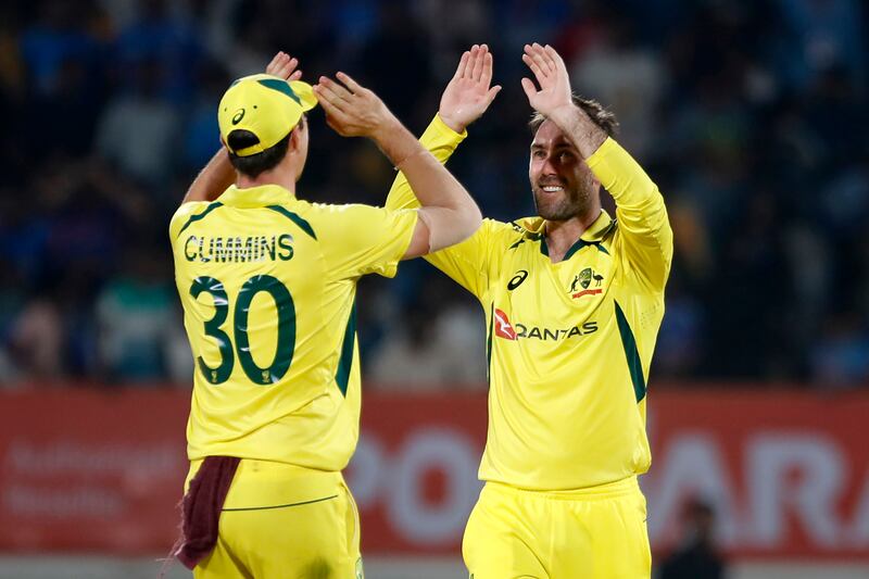 Australia bowler Glenn Maxwell, right, celebrates after taking the wicket of Indian batter Virat Kohli in Rajkot on September 27, 2023. Getty
