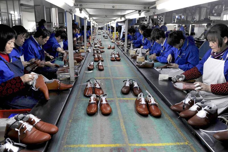 Employees work at a shoe factory in Lishui, Zhejiang province. The World Trade Organisation expects China’s share of world trade to rise to 20 per cent or more. Lang Lang / Reuters