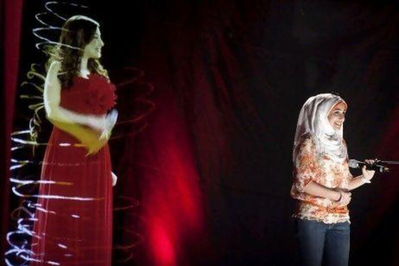 Sara Abdul Hamed, 17, from Egypt, sings alongside a hologram of the Lebanese singer Yara.