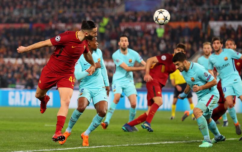 ROME, ITALY - APRIL 10:  Kostas Manolas of AS Roma scores his sides third goal during the UEFA Champions League Quarter Final Second Leg match between AS Roma and FC Barcelona at Stadio Olimpico on April 10, 2018 in Rome, Italy.  (Photo by Catherine Ivill/Getty Images)