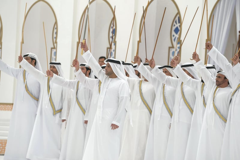 ADHAN, RAS AL KHAIMAH, UNITED ARAB EMIRATES - March 13, 2018: A traditional dance is performed during a mass wedding reception for HH Sheikh Mohamed bin Saud bin Saqr Al Qasimi, Crown Prince and Deputy Ruler of Ras Al Khaimah (not shown), at Mohamed bin Zayed, Al Bayt Mitwahid wedding hall. 

( Mohamed Al Hammadi / Crown Prince Court - Abu Dhabi )
---