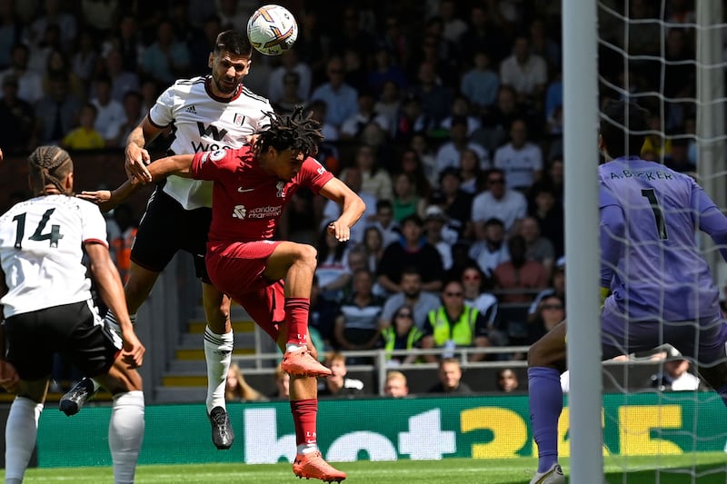 Fulham striker Aleksandar Mitrovic heads home the opening goal. AFP