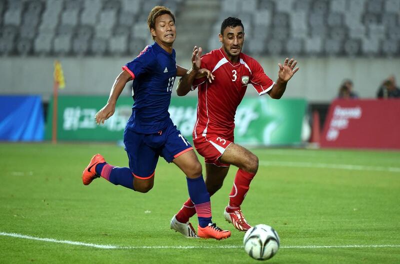 Palestine players, in red, will travel to Saudi Arabia to play in a World Cup qualifier. Stanley Chou / Getty Images