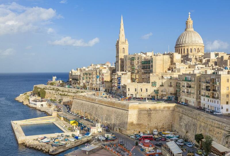 The Valletta skyline with the dome of the Carmelite Church and St. Pauls Anglican Cathedral. Neale Clark / Robert Harding World Imagery / Corbis