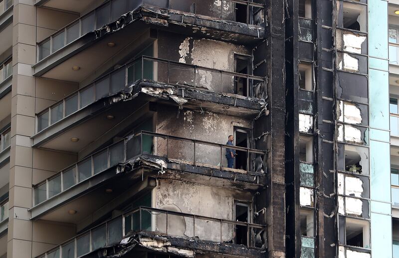 Fire damage at the high-rise on Monday morning after a blaze broke out overnight. Pawan Singh / The National