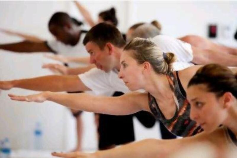 Melanie Swan takes a Bikram yoga class at Club Stretch in Dubai Marina. Razan Alzayani / The National