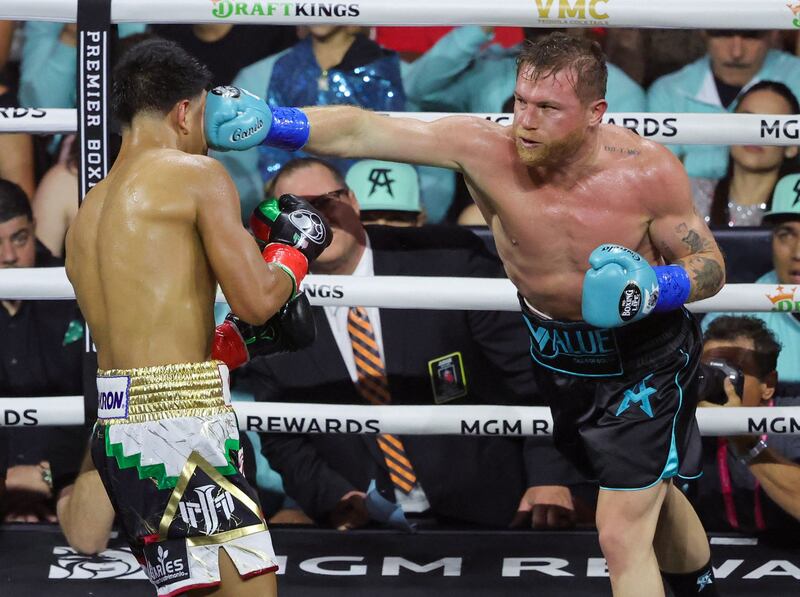 Canelo Alvarez lands a punch on Jaime Munguia in the fifth round. AFP