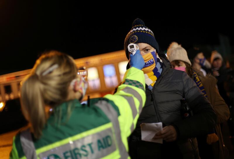 A fan has their temperature checked outside the stadium in New Meadow, Shrewsbury, Britain. Reuters