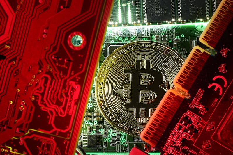 A copy of bitcoin standing on PC motherboard is seen in this illustration picture, October 26, 2017. Picture taken October 26, 2017. REUTERS/Dado Ruvic