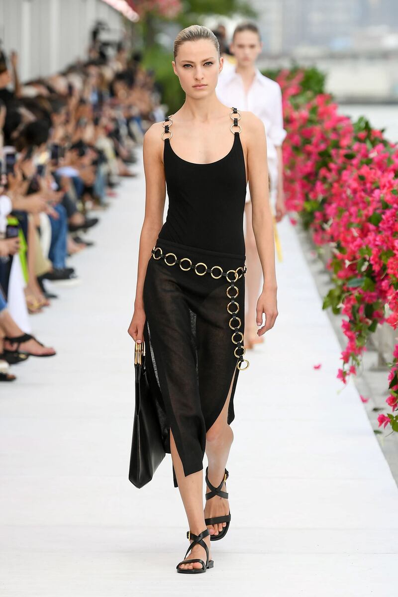 Sheer layers at the show, including a wrap skirt worn over a swimsuit