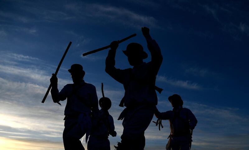 It's not all protests. In England, Morris Men dance as the sun rises on Primrose Hill in London. Neil Hall / EPA