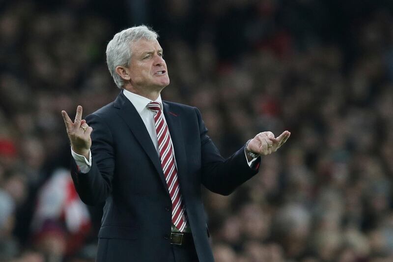 FILE - In this Saturday, Dec. 10, 2016 file photo, then Stoke City manager Mark Hughes gestures during the English Premier League soccer match between Arsenal and Stoke City at the Emirates stadium in London. Southampton have appointed Mark Hughes as their new manager, the Premier League club announced, Wednesday, March 14, 2018. (AP Photo/Tim Ireland, File)