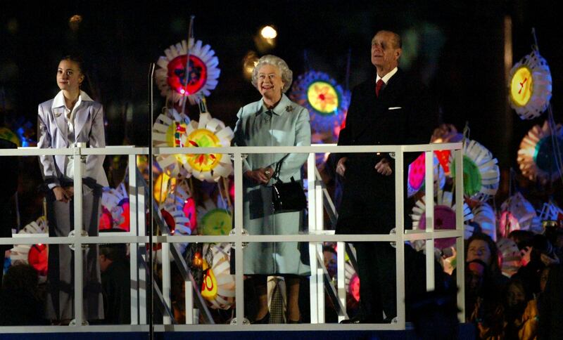 Queen Elizabeth and Prince Philip watch a fireworks display to celebrate her golden jubilee at Buckingham Palace in June 2002.