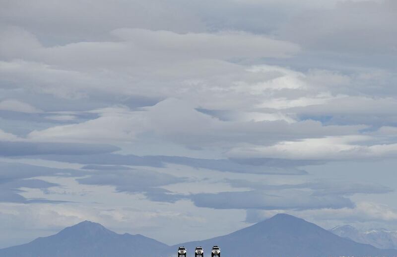 Dakar rally director Etienne Lavigne and sport director of the Dakar Rally, French David Castera ride through the Salar de Uyuni salt pan in Bolivia near the crest of the Andes as they scout locations for the 2015 Dakar Rally last week. Franck Fife / AFP / September 18, 2014