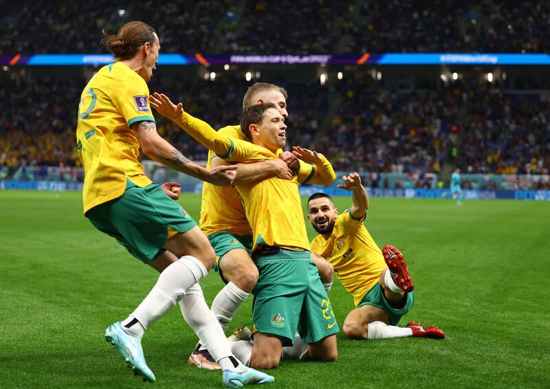 Australia's Craig Goodwin celebrates scoring their first goal with Riley McGree, Jackson Irvine and Aziz Behich. Reuters 