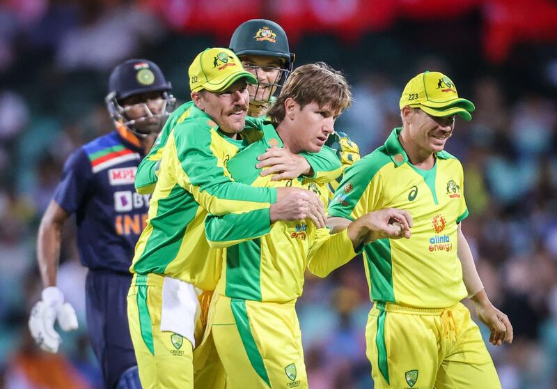 Australia's Adam Zampa, centre, celebrates after dismissing India’s Shikhar Dhawan during the first ODI in Sydney on Friday. AFP