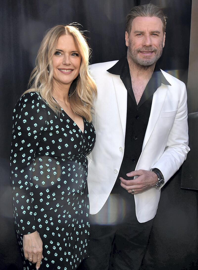 BROOKLYN, NY - JUNE 12: Kelly Preston and John Travolta attend the ceremony to honor John Travolta for his body of work in TV and Film, in anticipation of the release of Gotti movie on June 15th, 2018 at Lenny's Pizza on June 12, 2018 in Brooklyn, New York.   Theo Wargo/Getty Images for Gotti Movie/AFP
