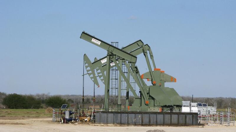 A pump jack used to help lift crude oil from a well in South Texas’ Eagle Ford Shale formation. Oil dipped lower on Friday. Anna Driver / Reuters