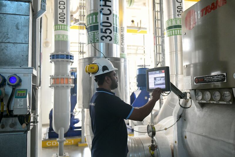 An engineer adjusts the settings at a Tabreed district cooling plant in Abu Dhabi. All photos: Khushnum Bhandari / The National 