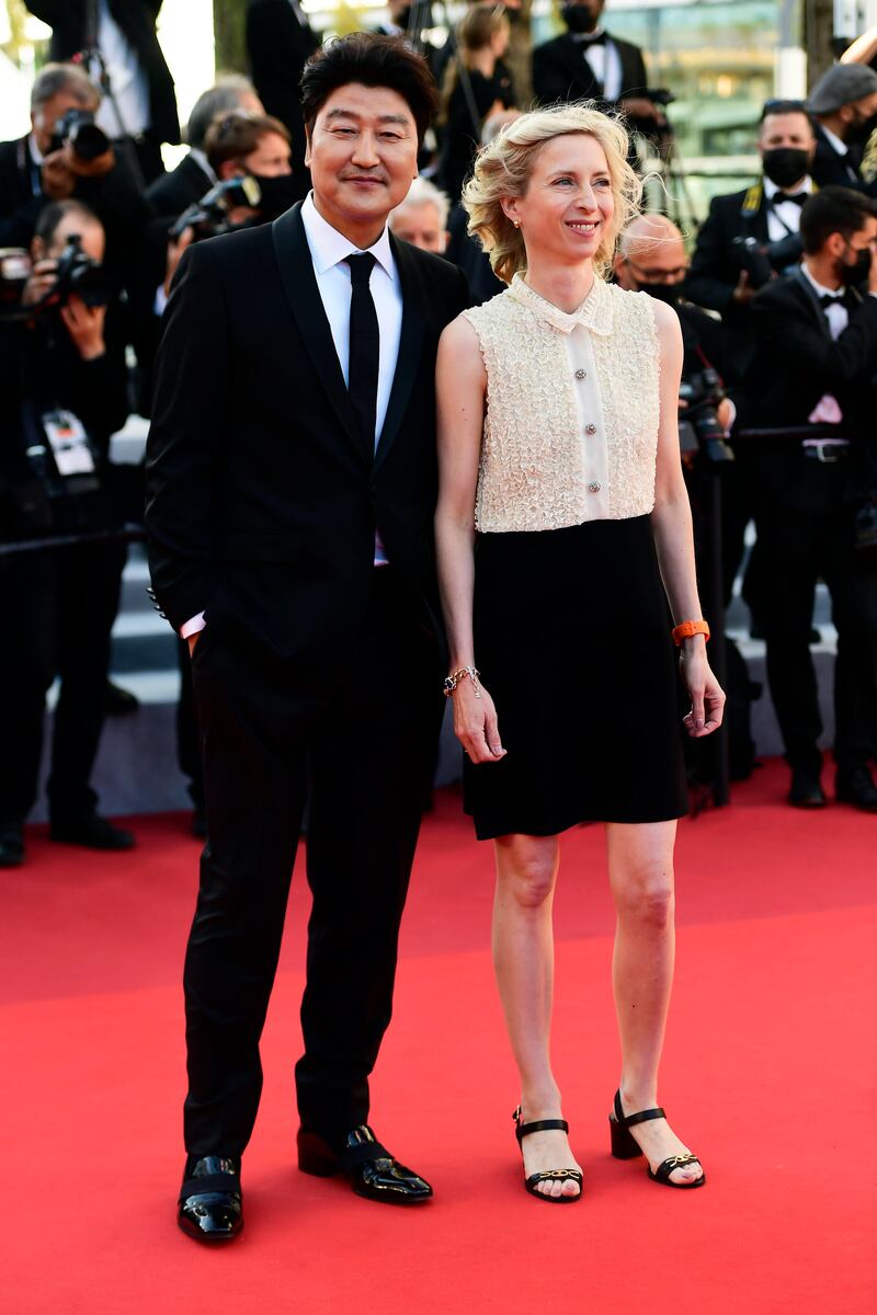 Song Kang-ho and Jessica Hausner attend 'The Story of my Wife' screening during the 74th annual Cannes Film Festival on July 14, 2021