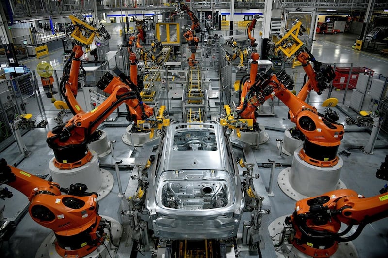 FILE PHOTO: Autonomous robots assemble an X model SUV at the BMW manufacturing facility in Greer, South Carolina, U.S. November 4, 2019. REUTERS/Charles Mostoller/File Photo