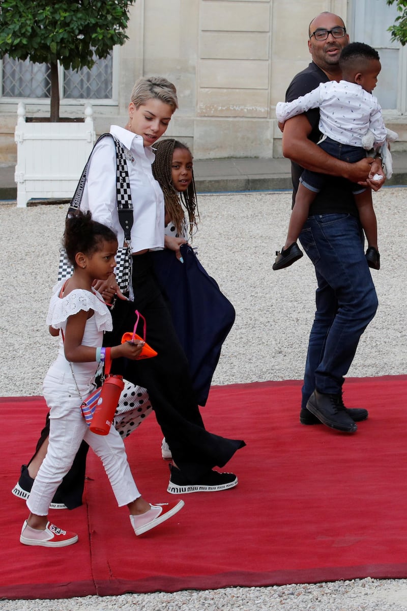 Isabelle Matuidi, wife of France's soccer player Blaise Matuidi, and their children arrive to attend a reception to honour the France soccer team after their victory in the 2018 Russia Soccer World Cup, at the Elysee Palace in Paris, France, July 16, 2018. REUTERS/Philippe Wojazer