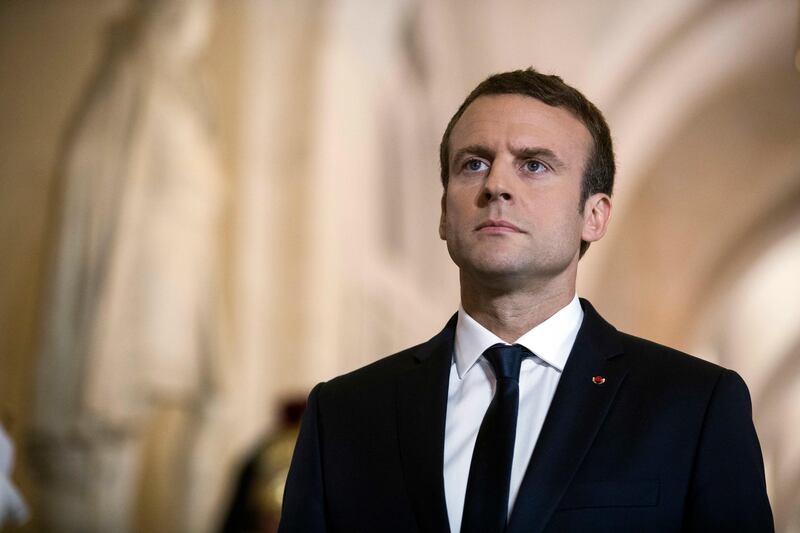 French president Emmanuel Macron walks through the Galerie des Bustes to access the Versailles Palace's hemicycle where both houses of parliament were gathered, outside Paris, on July 3, 2017. Etienne Laurent / Pool Photo via AP