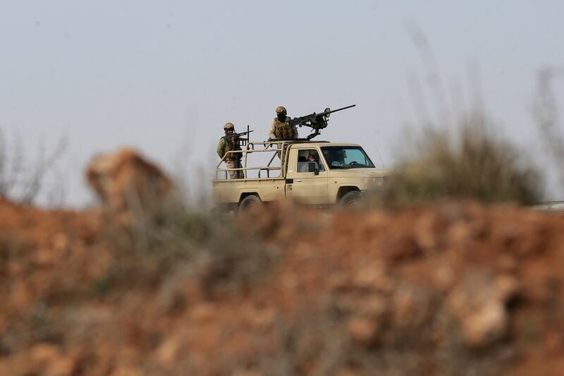 Jordanian soldiers patrol near the eastern Jordan-Syria border in Al Washash, Mafraq governorate. AP