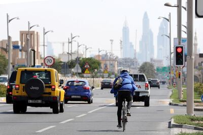 DUBAI, UNITED ARAB EMIRATES , May 22– 2020 :- One of the person riding bicycle on Jumeirah beach road in Dubai. (Pawan Singh / The National) For News/Online. 