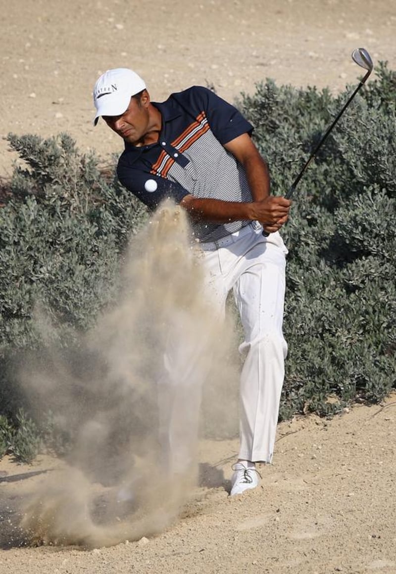 Arjun Atwal of India in action during the final round of the Dubai Open at The Els Club Dubai on December 21, 2014 in Dubai, United Arab Emirates.  (Photo by Francois Nel/Getty Images)