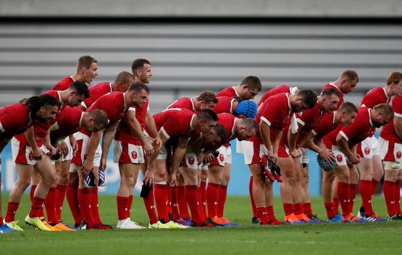 Wales players bow to the crowd after the match in Toyota City. AFP