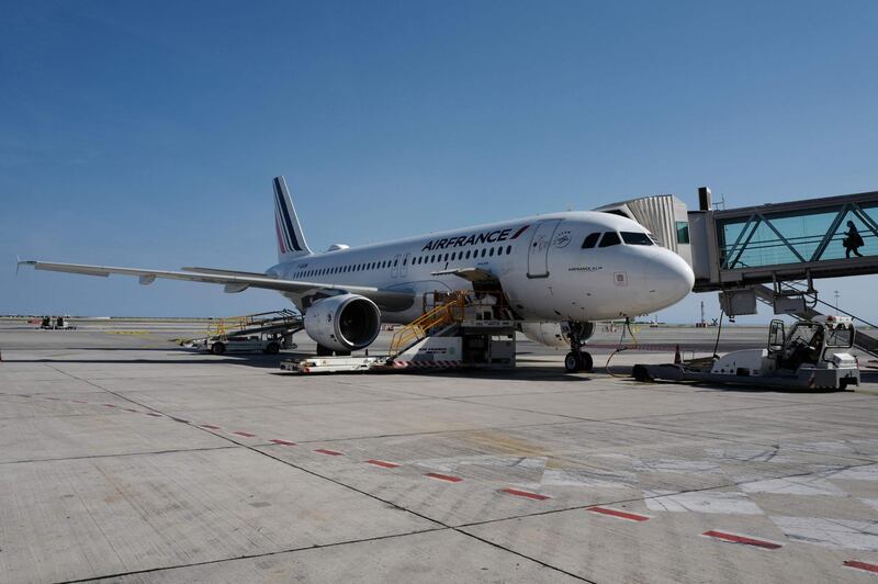 This picture taken on May 7, 2020 shows an Air France plane at the finger of the Nice International airport in the French Riviera city of Nice, southern France, on the 52th day of a lockdown in France aimed at curbing the spread of the COVID-19 pandemic, the novel coronavirus.   / AFP / VALERY HACHE
