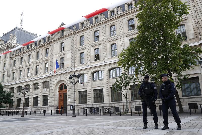 French police and security forces establish a security perimeter near Paris police headquarters. EPA