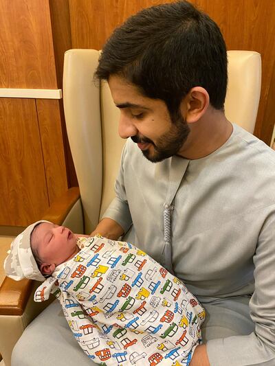 Baby Abdullah with his father, Ali Al Shehhi. The boy was the first baby born at Danat Al Emarat Hospital in the New Year - at 1.01am. Courtesy Danat Al Emarat