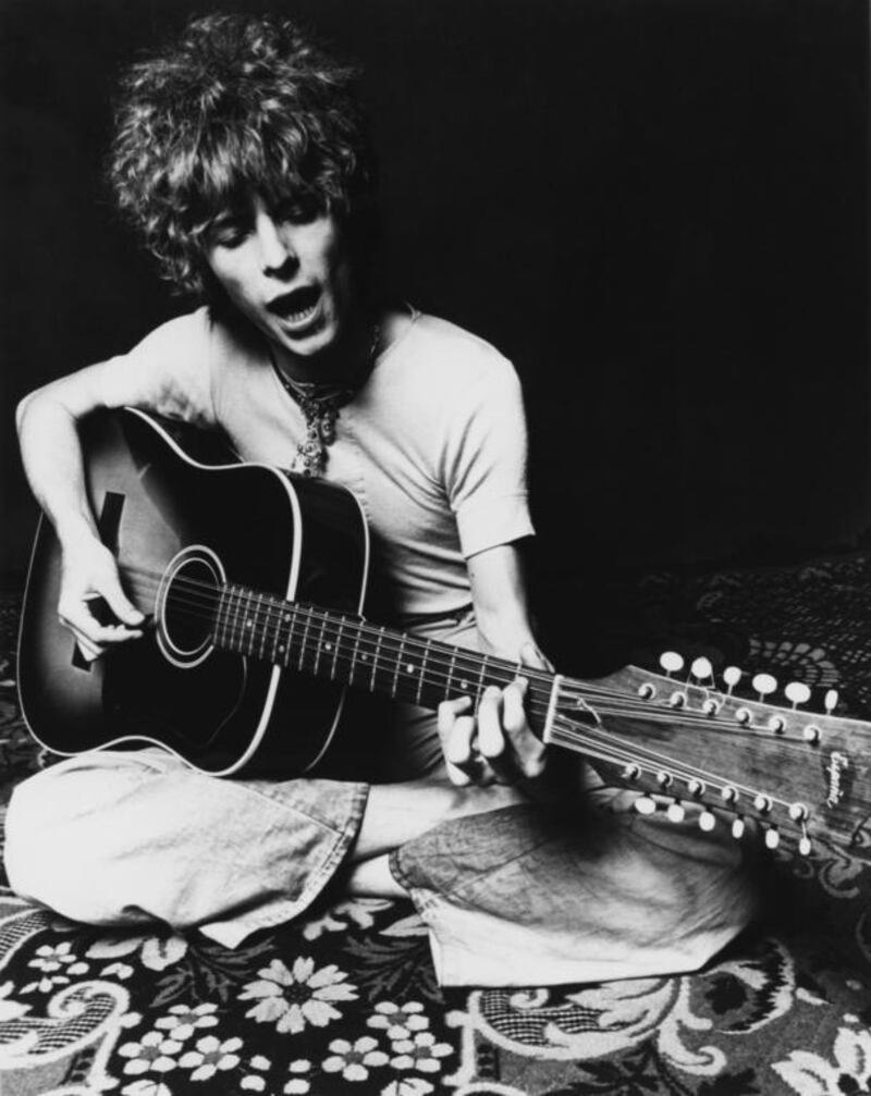 Musician David Bowie plays an acoustic Espana 12-string guitar to promote the release of his album Space Oddity in November 1969 in London, England. Michael Ochs Archives / Getty Images