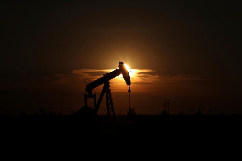 FILE - This June 27, 2017, file photo shows an oil rig at sunset in Midland, Texas. President Donald Trump relentlessly congratulates himself for the healthy state of the U.S. economy, with its steady growth, low unemployment, busier factories and confident consumers. But in the year since Trumpâ€™s inauguration, most economists tend to agree on this: The economy has essentially been the same sturdy one that he inherited from Barack Obama. (Steve Gonzales/Houston Chronicle via AP, File)