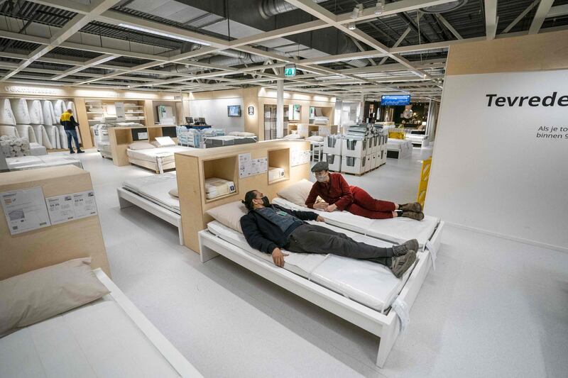 Customers makes purchases at an IKEA store in Amsterdam, the Netherlands. Due to the lifting of some coronavirus restrictions, stores can receive a maximum of 50 customers per time slot instead of two. AFP