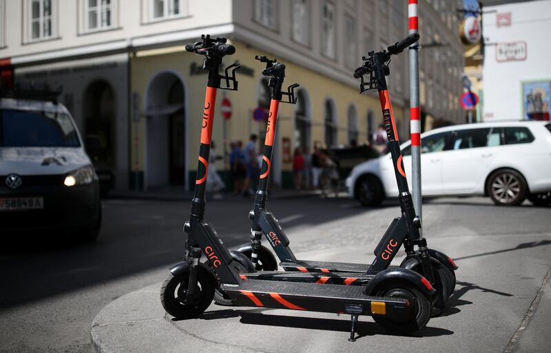 Electric scooters are seen from Circ park near a road in Vienna, Austria, July 24, 2019.  REUTERS/Lisi Niesner