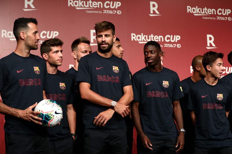 From left: Barcelona players Sergio Busquets, Gerard Pique, Ousmane Dembele and Hiroki Abe pose during a reception party in Tokyo. AFP