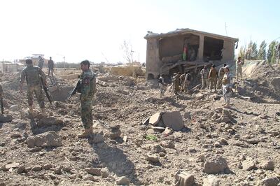 Afghan security personnel walk at the site of a suicide attack at a police training centre in Gardez, capital of Paktia province, on October 17, 2017.
The death toll in an ongoing suicide and gun attack on a police training centre in a southeast Afghan city has risen to 32 with more than 200 wounded, a hospital official said October 17. "The hospital is overwhelmed and we call on people to donate blood," said Shir Mohammad Karimi, deputy health director in Gardez. / AFP PHOTO / FARID ZAHIR