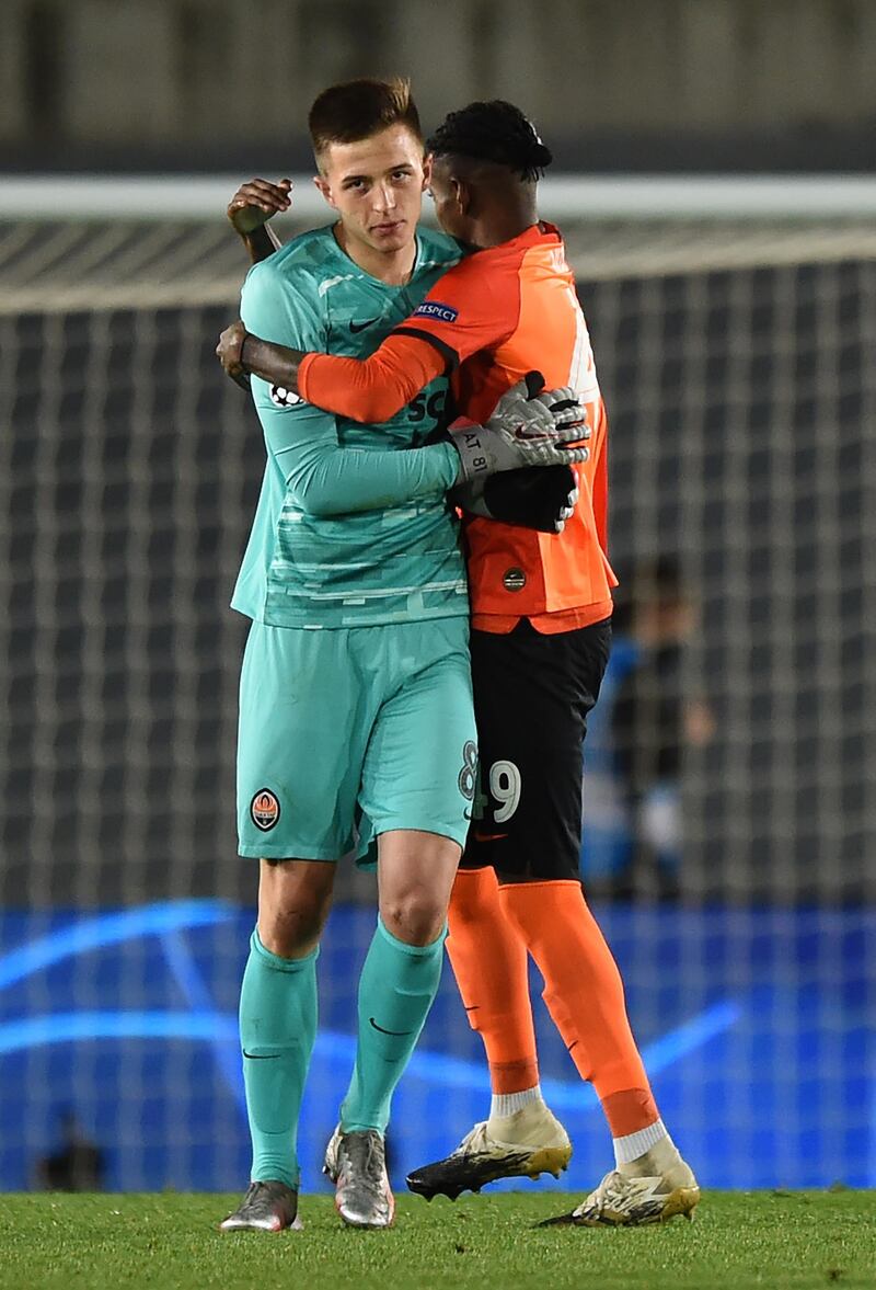 Vitao  celebrates with Anatolii Trubin after the victory for Shakhtar. Getty