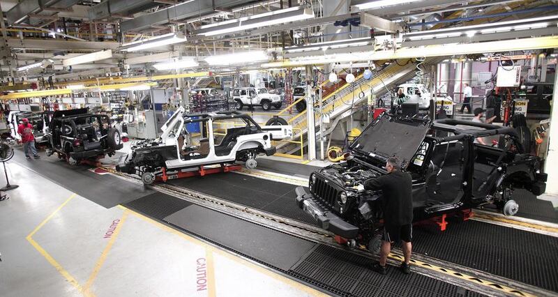 Workers assemble the 2014 Jeep Wrangler. Bill Pugliano / Getty Images / AFP