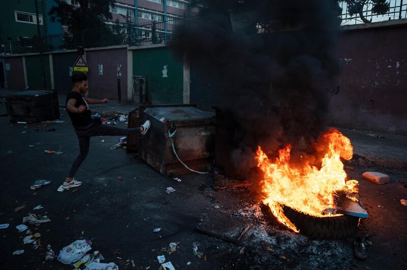 Anti-government protesters burn tires and garbage containers to block a main road, during ongoing protests against the Lebanese government, ,in Beirut, Lebanon. AP Photo