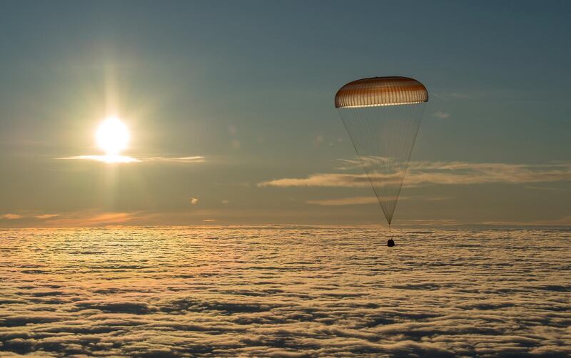 The Soyuz MS-06 capsule carrying the crew of Joe Acaba and Mark Vande Hei of the US, and Alexander Misurkin of Russia descends beneath a parachute just before landing in a remote area outside the town of Dzhezkazgan (Zhezkazgan), Kazakhstan. Bill Ingalls / NASA / Handout via Reuters