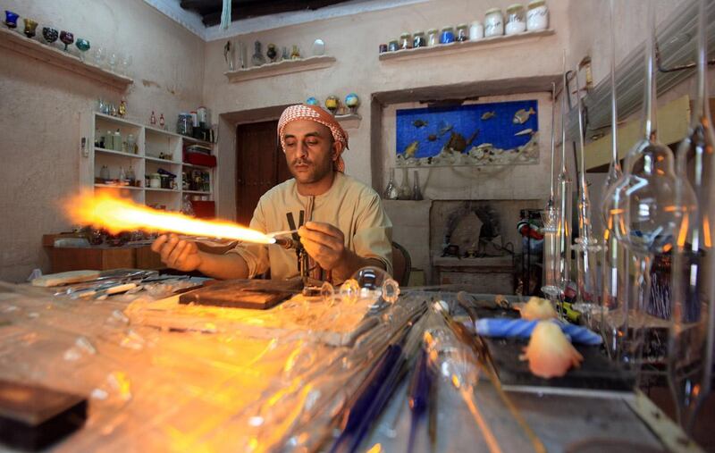 03 AUGUST 2010 - Abu Dhabi - Noor Ahmed showing his glass blowing work skills to tourist at Emirates Heritage village on the Corniche in Abu Dhabi. Ravindranath K / The National