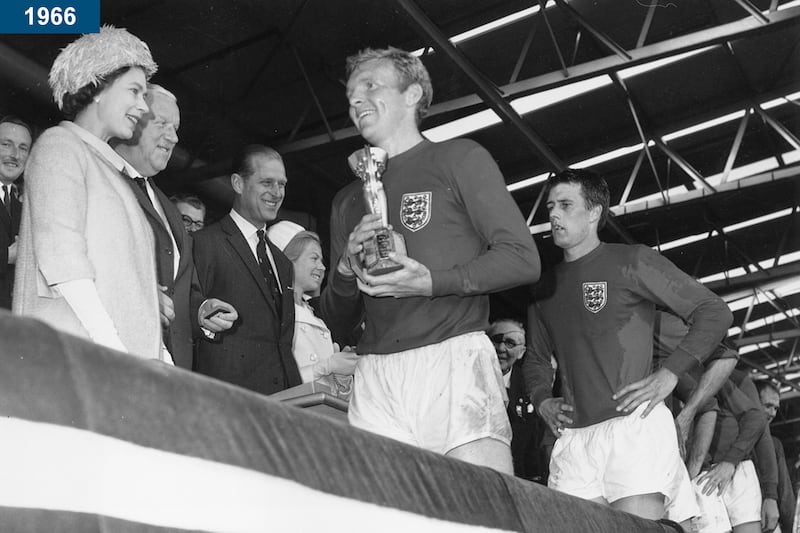 1966: The queen smiling after presenting England captain Bobby Moore with the Jules Rimet trophy, following England's 4-2 victory over West Germany in the World Cup Final at Wembley Stadium, London.