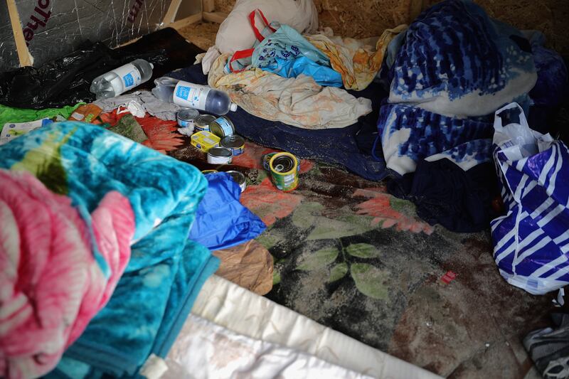 Bedding and food left inside a shack in the nearly deserted camp in 2016